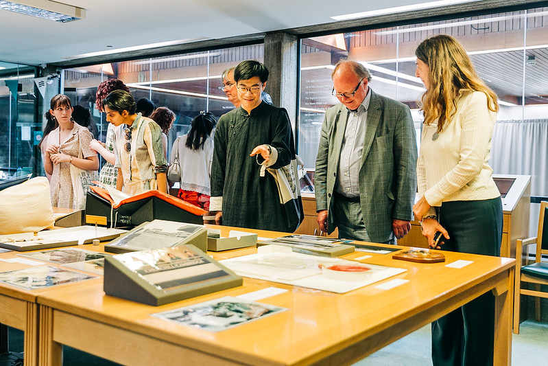 Archives centre visitors examining books