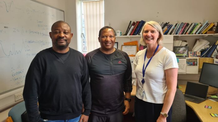 Ayodele Ladokun and Luvuyo Wotshela with Caroline Trotter, the Director of Cambridge Africa